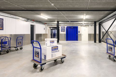 EasyBox Self Storage facility in Italy, newly acquired by Safestore, with a modern blue exterior and clear signage, taken on a sunny day.